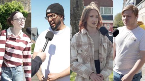 Four people pictured in a split screen formation. Far left woman in stripey red and white top and glasses, brown hair. Second from left a tall man with beard, glasses, black beanie hat and white t-shirt talking into a microphone. Third from left a woman with red hair talking animatedly wearing a brown and white top. Final person far right is a man wearinf a off-white t-shirt, jeans and ginger hair.