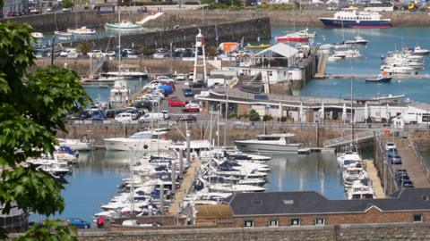 A birdseye view of Guernsey harbour. You can see several boats in the harbour
