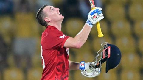 England captain Harry Brook raises his bat after hitting a century