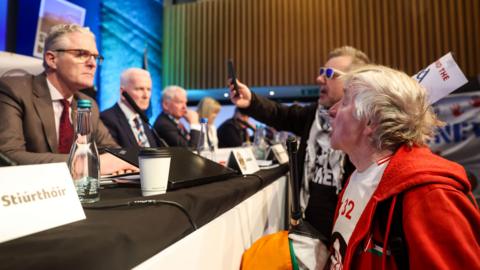 Protesters confront GAA president Jarlath Burns