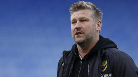 Oxford United manager Karl Robinson says the club is still aiming to bring in a new striker before the transfer window closes.