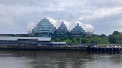 The Glasshouse is a slug-shaped glass building on the banks of the Tyne in Gateshead.