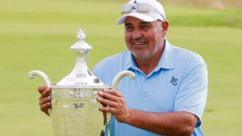 Angel Cabrera holds the Senior PGA trophy