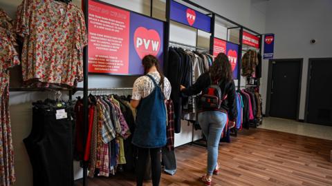 Women browsing vintage clothes