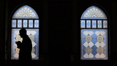 A man prays in a mosque in Dubai during Ramadan