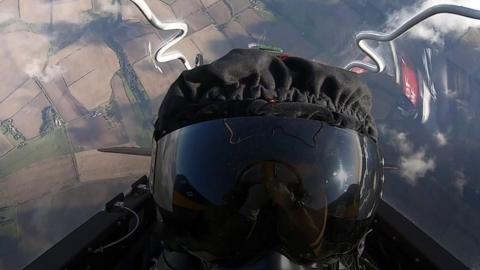 A pilot in a cockpit