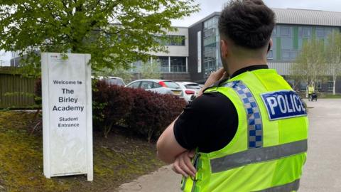 A police officer at the Birley Academy in Sheffield