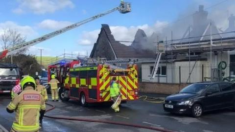 The emergency services fighting a fire at Manorbier School in Tenby