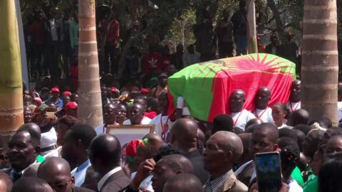 Jonas Savimbi's coffin is carried to its final resting place