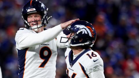 Will Lutz celebrates his game-winning field goal with a Denver Broncos team-mate
