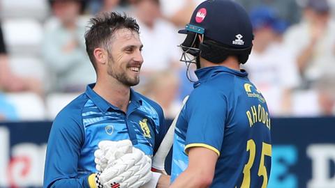 Ed Barnard is congratulated on reaching his ton by Will Rhodes