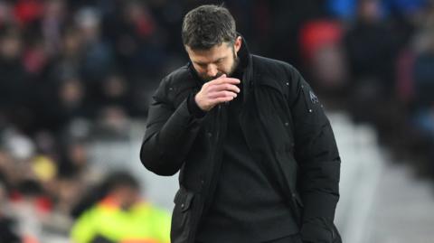 Middlesbrough manager Michael Carrick looks to the floor during their defeat to Sunderland