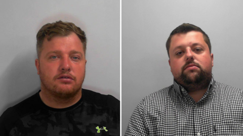 Police custody images of two men. The man on the left has brown hair and short facial hair and blue eyes and is wearing a black T-shirt with a lime green logo on it. The man on the right has short dark hair with a short goatee beard and is wearing a black and white gingham shirt.