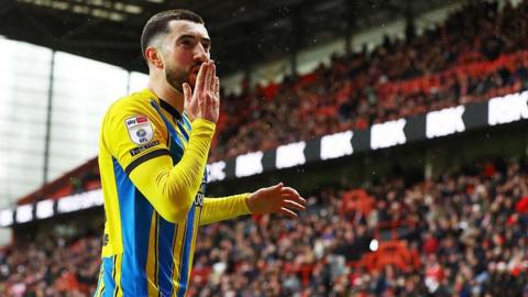 Finn Azaz celebrates after scoring 