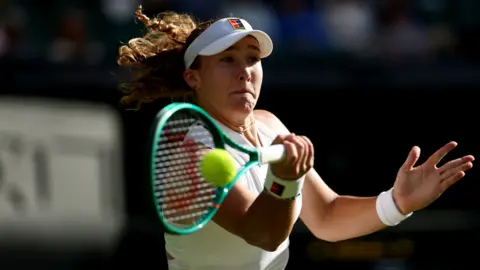 Mirra Andreeva hits a forehand