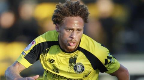 Stephen Duke-McKenna in action for Harrogate Town