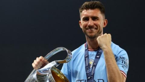 Aymeric Laporte celebrates with the Champions League trophy