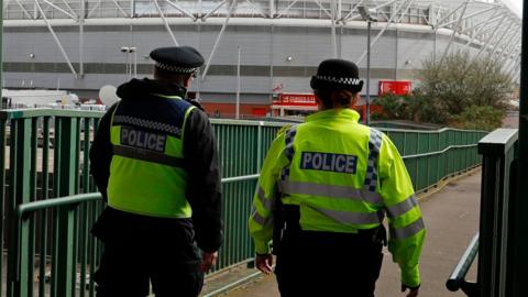 Two police officers patrolling outside St Mary's Stadium in Southampton in April 2017.