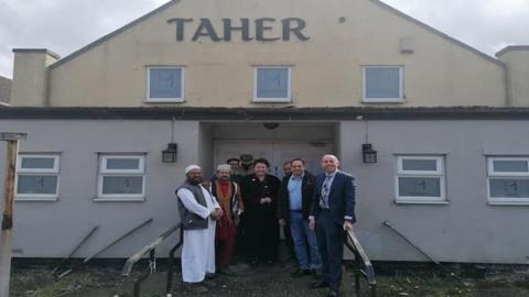 Rob Waltham and members of the community outside what will be the centre