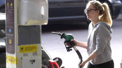 woman at petrol station