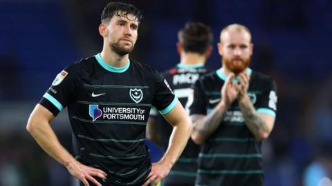 Callum Lang of Portsmouth looks dejected after the Championship match against Cardiff City at the Cardiff City Stadium