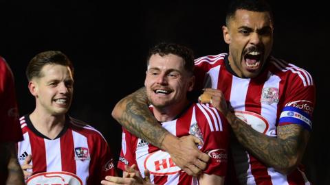 Exeter City celebrate Jack McMillan's goal