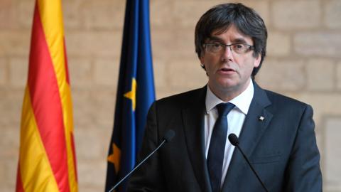 This file photo taken on October 26, 2017 shows Catalan president Carles Puigdemont making a statement at the Generalitat (Catalan government headquarters) in Barcelona.