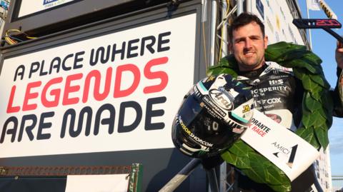 Michael Dunlop celebrates his Superstock victory