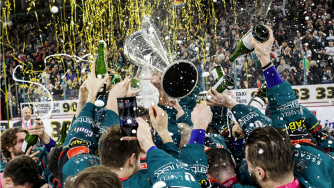 Belfast Giants celebrate with the Elite League trophy