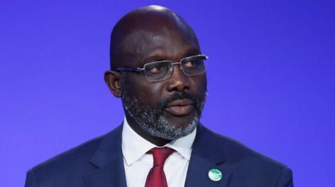 George Weah during a summit address as Liberia president