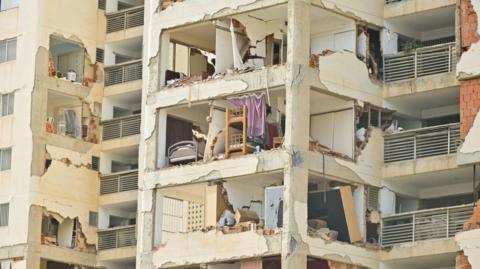 A view of the remains of a building damaged in the aftermath of earthquakes in La Guaira, Venezuela
