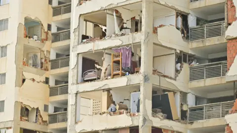A view of the remains of a building damaged in the aftermath of earthquakes in La Guaira, Venezuela