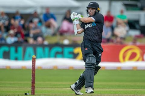 Tom Latham hooks a boundary for New Zealand against Ireland.