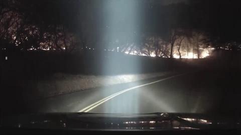 wildfires seen through a car windscreen