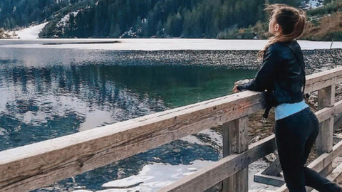 Young girl by mountains