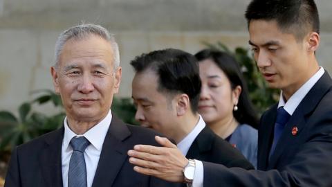 Chinese Vice Premier Liu He leaves the US Trade Representative offices after the first day of a new round of trade negotiations in Washington