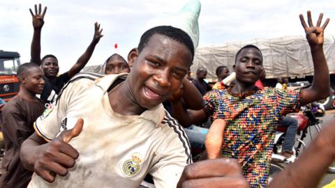 People celebrate the re-election of All Progressive Congress (APC) presidential candidate, President Muhammadu Buhari, in Abuja, Nigeria, 27 February 2019