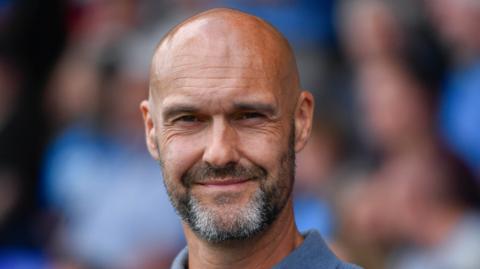 Peterborough United boss Luke Williams smiling