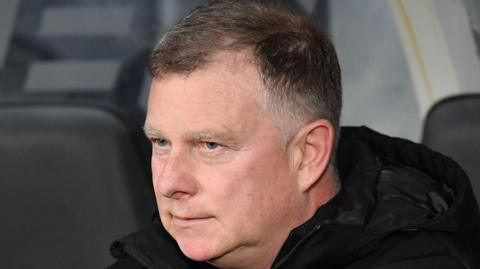 Stoke City boss Mark Robins looking pensive 