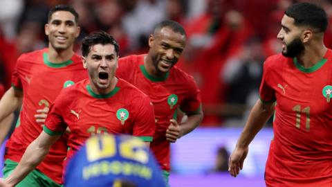 Brahim Diaz (second left) celebrates a goal with his Morocco team-mates
