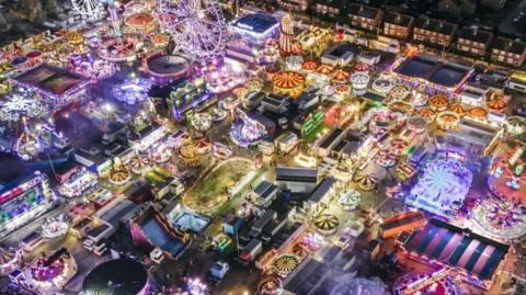 An aerial view of brightly coloured lights on Hull Fair rides