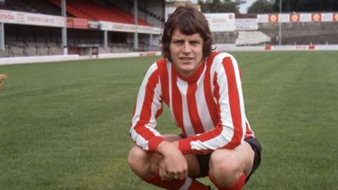 Mick Channon poses for a photo in his Southampton shirt 