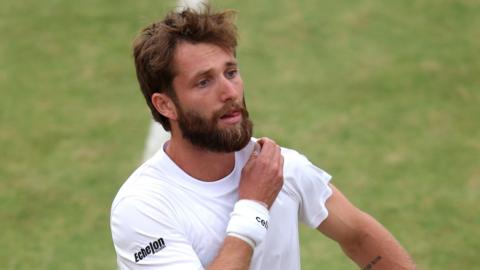 Corentin Moutet reacts to a missed point during his Queen's first-round match