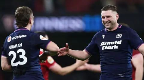 Finn Russell high fives Darcy Graham