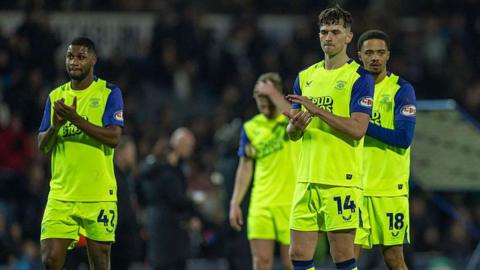 Preston North End players applaud the fans after their defeat at Blackburn Rovers