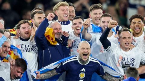 Steve Clarke celebrates with his Scotland players 