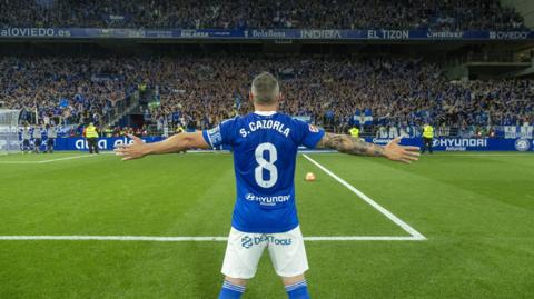 Santi Cazorla celebrates in front of Real Oviedo fans