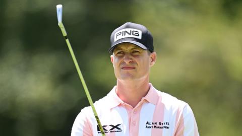 Calum Hill eyes an iron shot