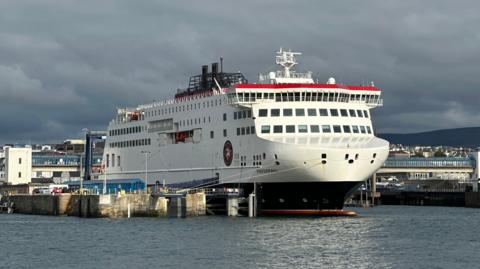 The Manxman ferry moored in Douglas Harbour. It is in the Steam Packet's colours of white, black and red.