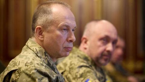 Side view of Syrsky, who is wearing camouflaged military uniform